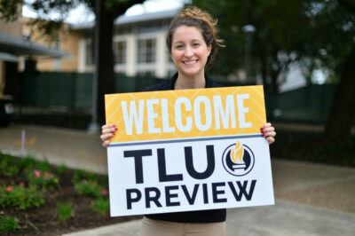 Girl with TLU Preview Sign
