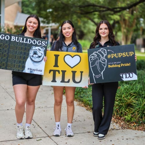 Group of current students with welcome signs