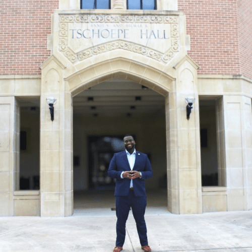 Brandon Chaney on front of Tschoepe Building