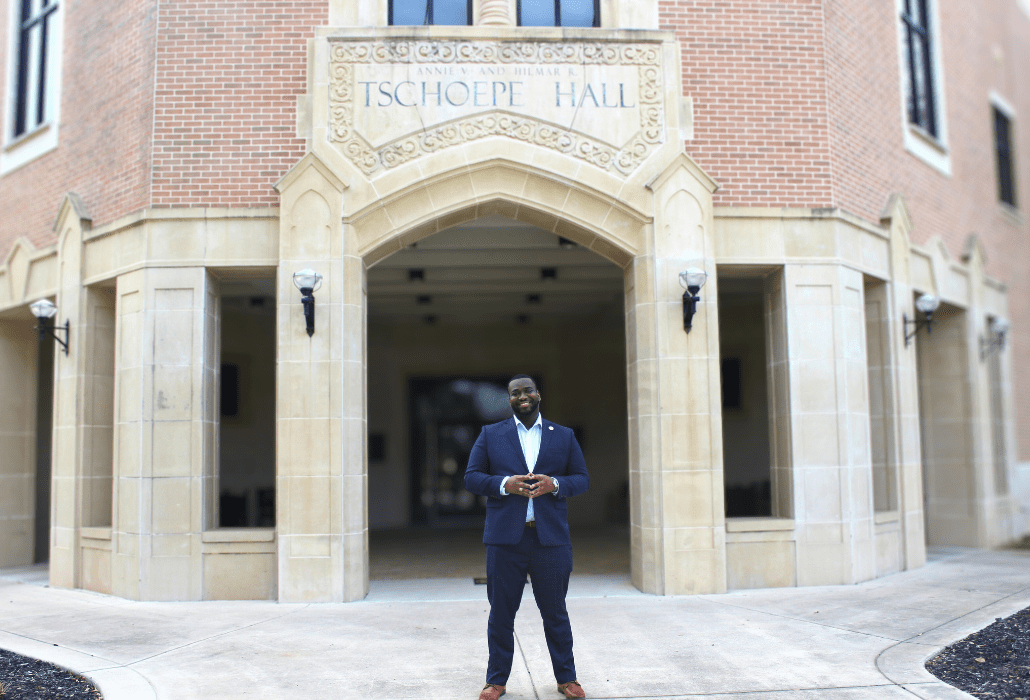 Brandon Chaney on front of Tschoepe Building