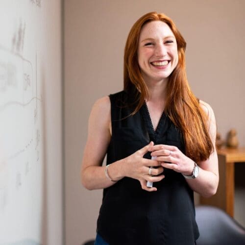 A student in front of a whiteboard