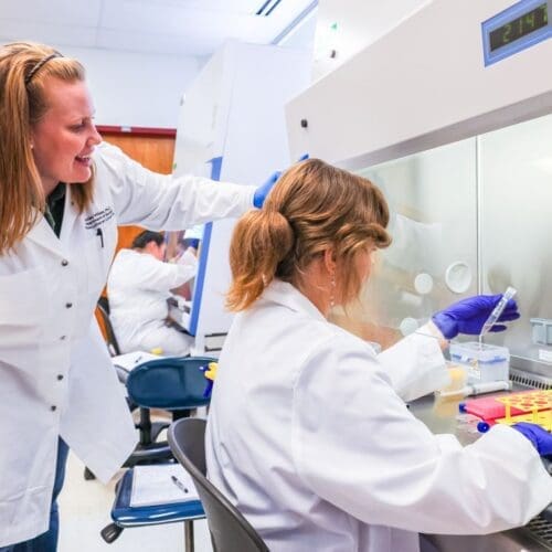 Professor and student in biology lab