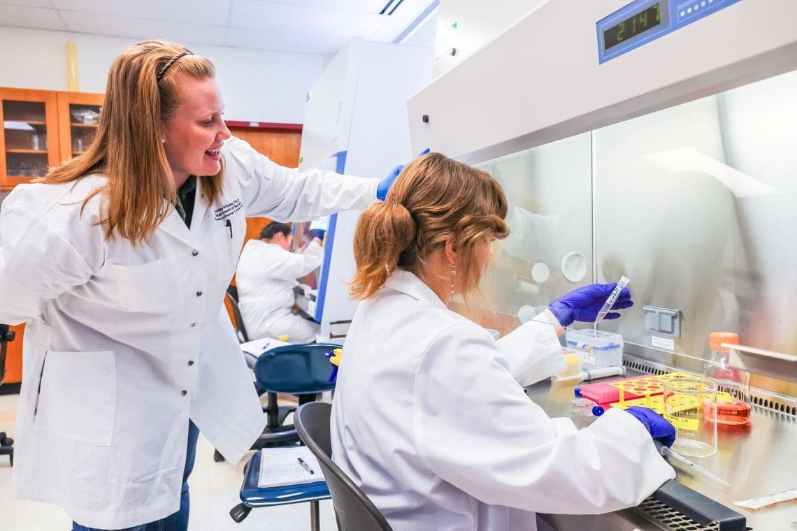 Professor and student in biology lab