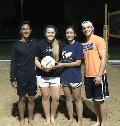 A group of TLU students on the volleyball courts