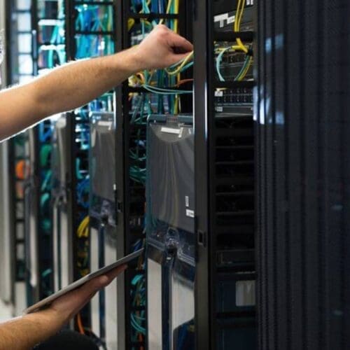 Stock Image of person working on network systems