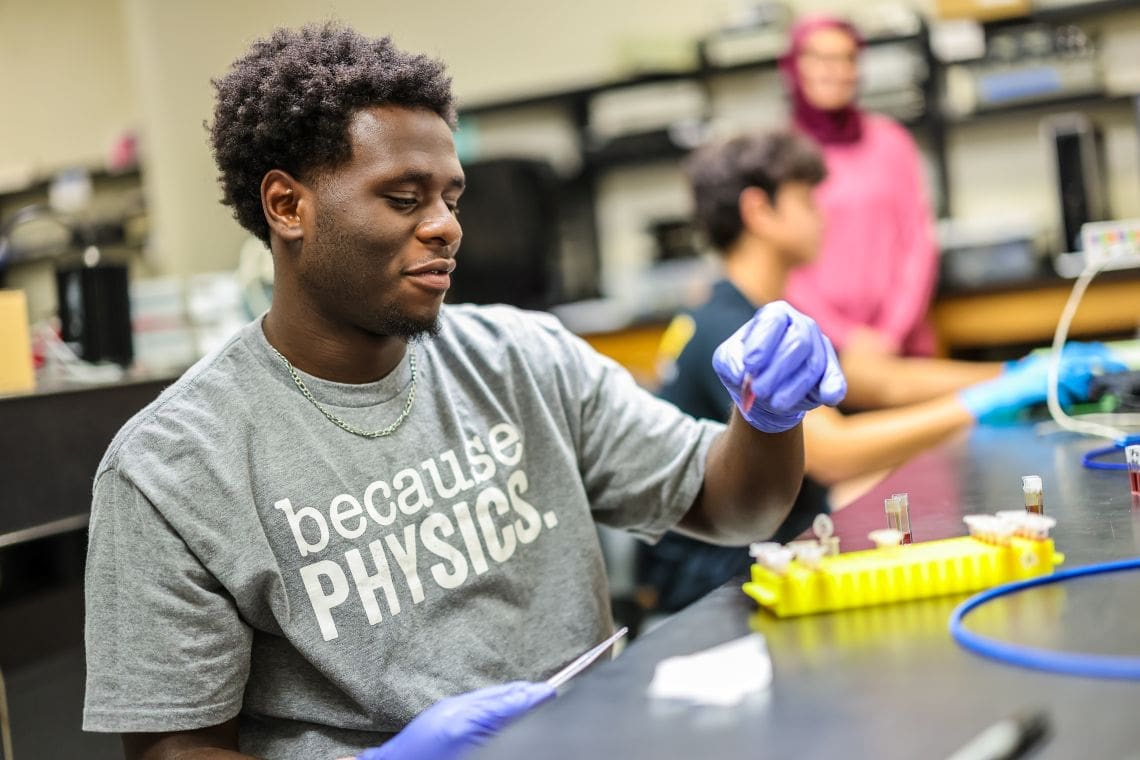 Physics student in lab
