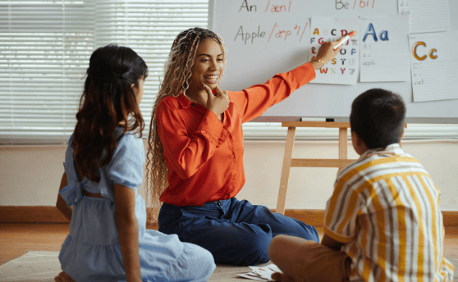 stock photo of teacher teaching small children