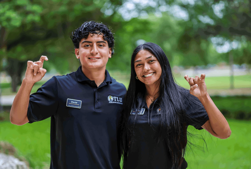Pups Up sign with two students