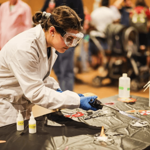 Hallie McCulloch doing a science lab