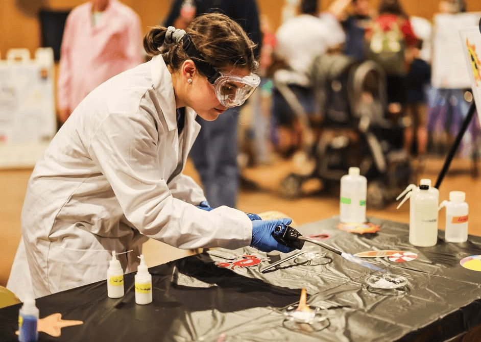 Hallie McCulloch doing a science lab