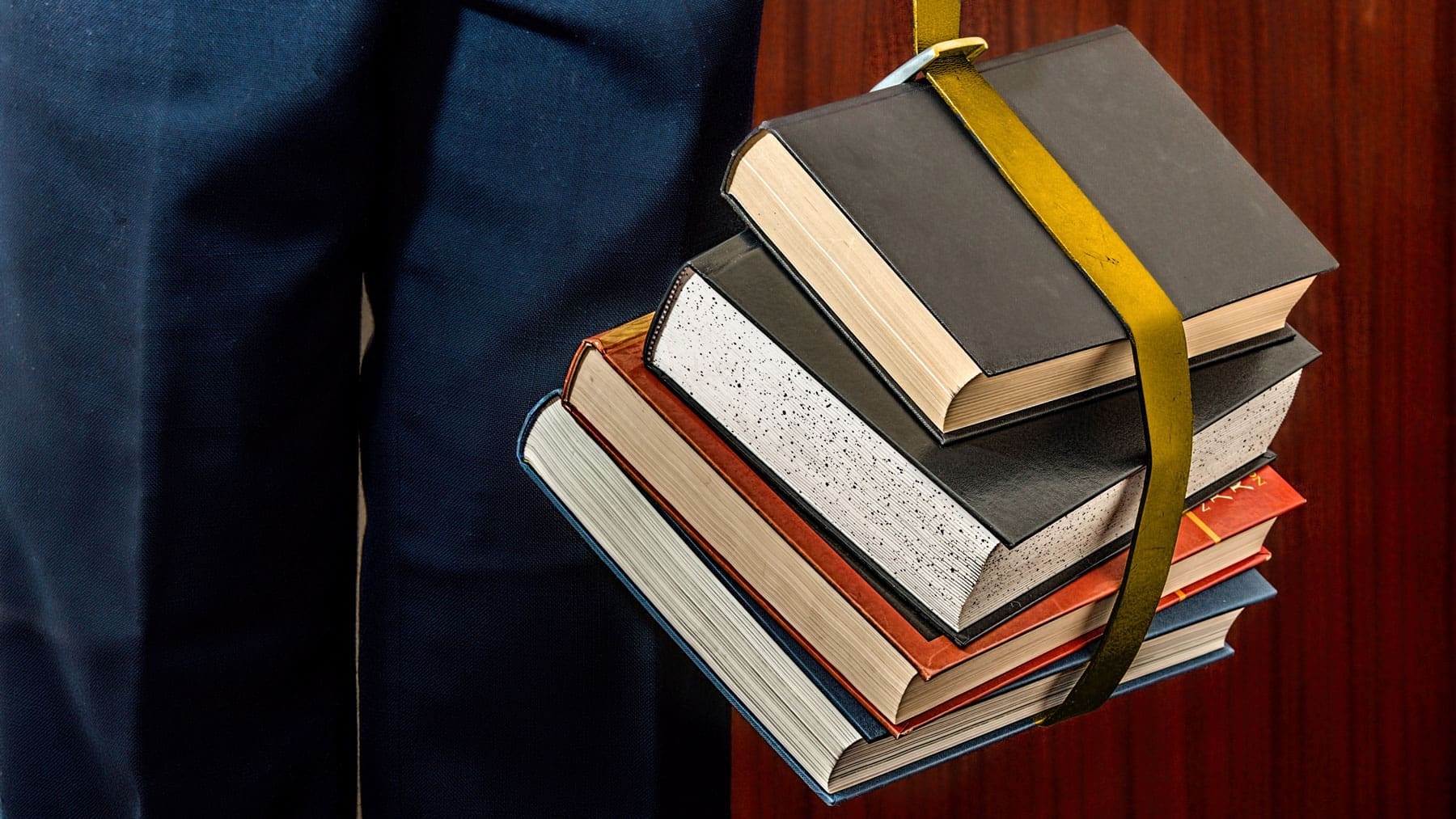 Books with a belt wrapped around them