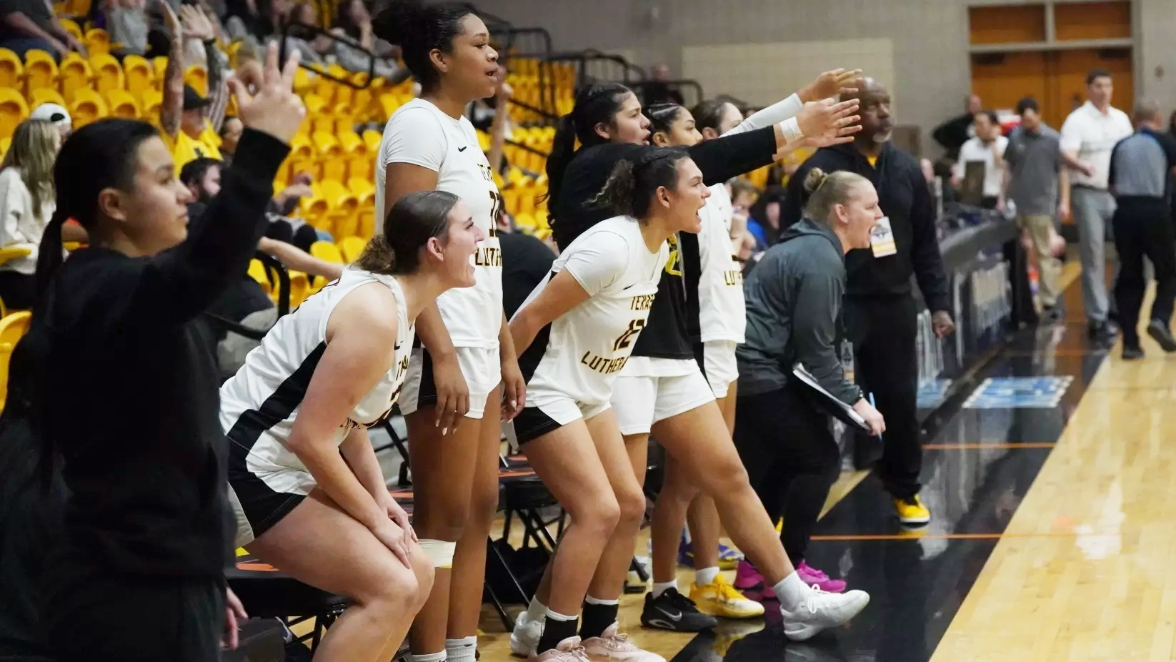 TLU women's bulldog basketball cheering at a game